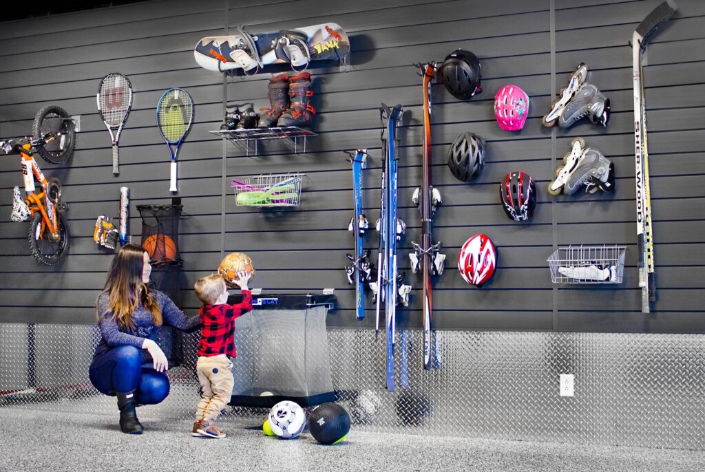 Garage slatwall organizer with sports gear